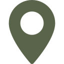 Un icône de localisation verte sur un arrière-plan noir.